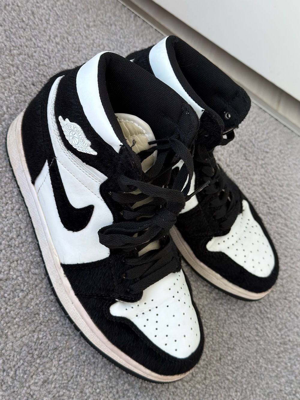Jordan Women’s High Top Sneakers in Black and White